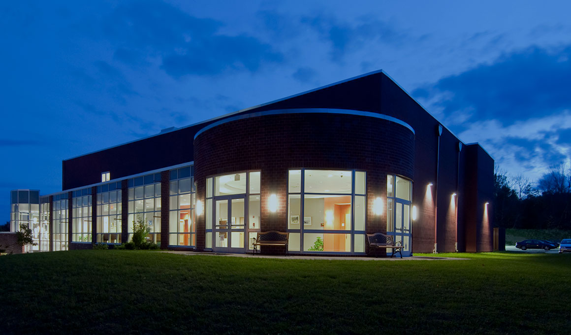 A building on Sussex County Community College's campus in the evening