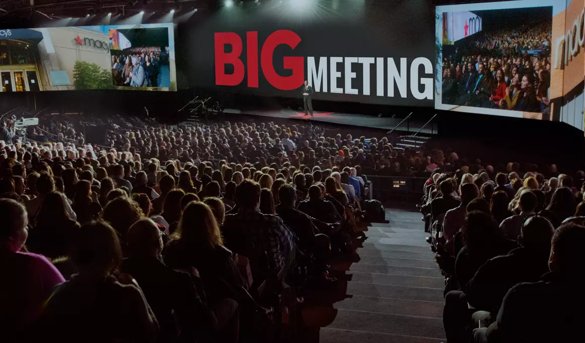 Macy's Big Meeting, an internal meeting held annually for leadership to share vision, strategy, accomplishments, is held in a large auditorium with every seat filled.